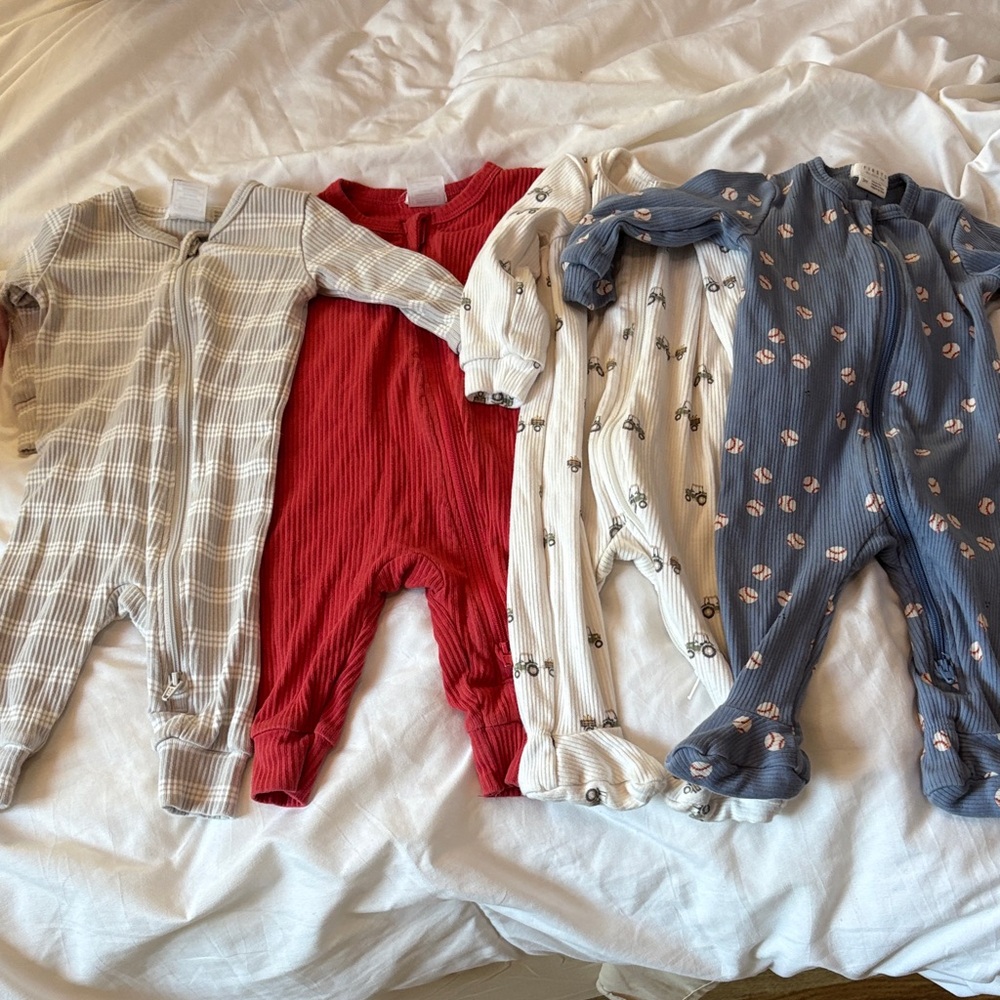 Set of Four Baby Onesies in Red, Blue, Cream, and Gray